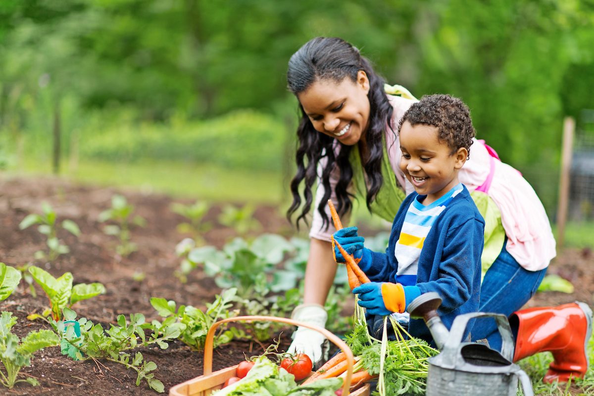 Mother and son gardening together