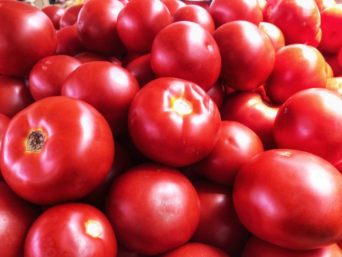 Farmers market of freshly picked bush early girl tomatoes